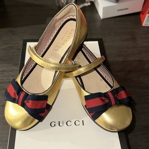 Gold Gucci bow tie flats
